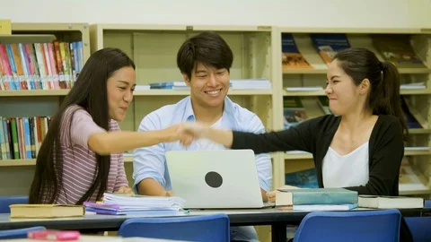 Three students look happy after finishing their project Video stock 85683127