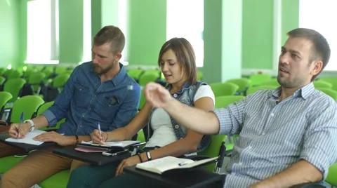 Three students sitting at the lecture Stock Footage 67717147