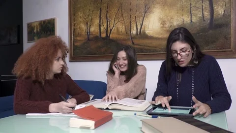 Three students studying together at home Stock Footage 304972274