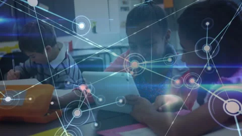 Three students writing and tapping tablets, activating expanding network graphic Video stock 311885318