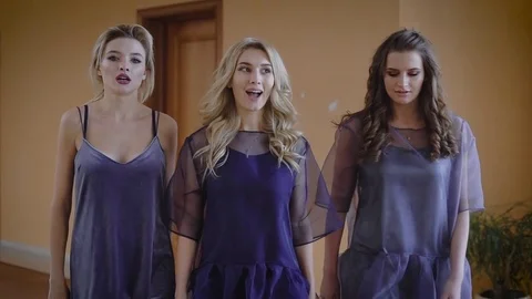 Three stunning cocottes actively communicate and walk the hall in a luxurious Video stock 73264576