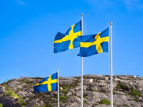 Three swedish flags Stock Photos