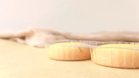 Three sweet biscuits on a wooden table Stock Footage 146249724