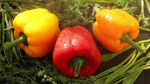 Three sweet peppers, yellow, red, orange Stock-Footage 239845129