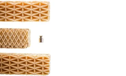 Three sweet rectangular shaped waffles and 2 grams metal weight or dumbbell Fotos de archivo