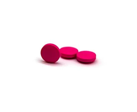 Three tablets are pink in colour Stock Photos