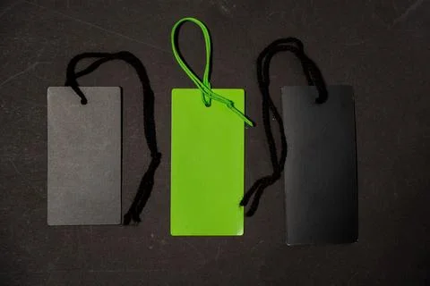 Three tags are displayed on a black background, one of which is green Stock Photos
