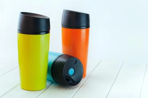 Three take-out coffee cups on the white wood table Stock Photos