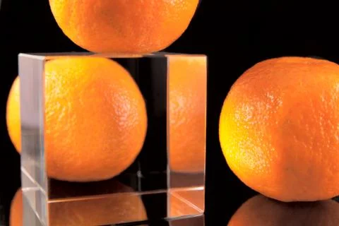 Three tangerines with cube Stock Photos