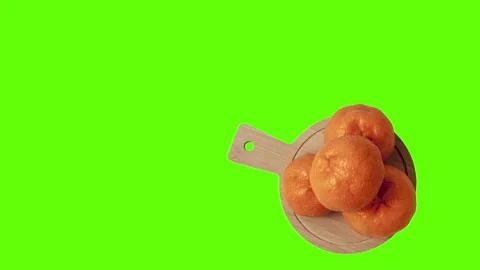 Three tangerines on a green background Video stock 148572919