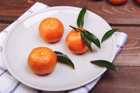 Three tangerines Stock Photos