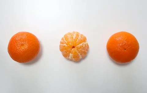 Three tangerines on white background Stock Photos