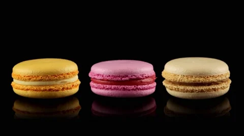 Three tasty colorful macarons rotating Stock Footage 58664085