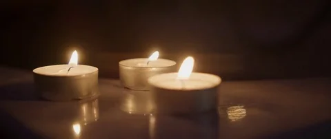 Three tea lights Stockbeeldmateriaal 77279441