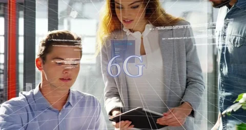 Three tech colleagues typing tapping tablet at desk generating overlays code Stock Footage 317183934