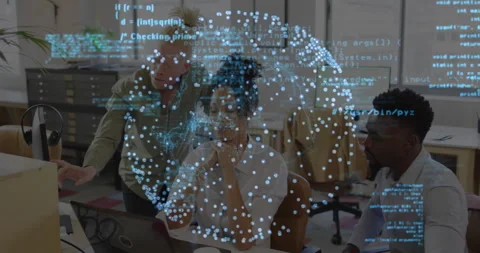 Three tech professionals collaborating around laptops at office desk, with code Stock Footage 308676954