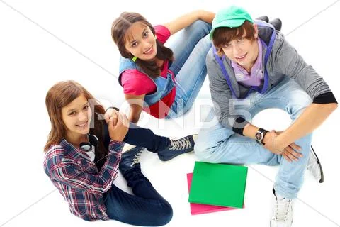 Three teenagers in casual clothes looking at camera Stock Photos