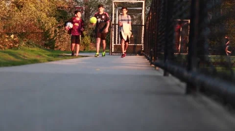 Three teens walking on soccer training Stock Footage 56249270