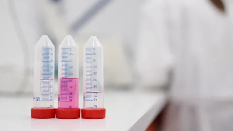Three test tubes on a desk Stock-Footage 255196090