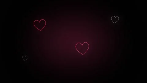 Three thin, glowing neon heart outlines floating on a dark, vignetted with .. Stock Footage 346563994