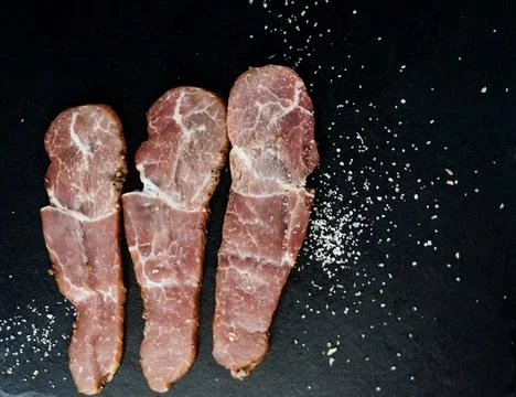 Three thin slices of ham Stock Photos