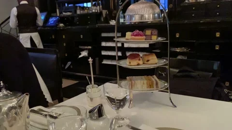 Three-Tiered Serving Plate for Afternoon Tea at The Wolseley in London Stock Footage 154106815