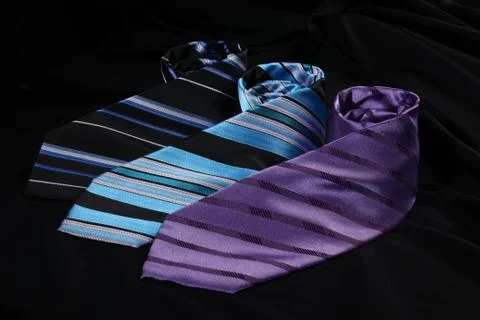 Three ties on the black background Stock Photos