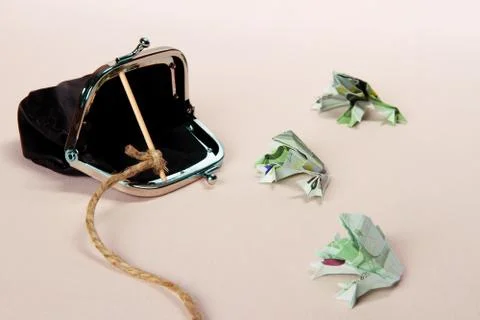 Three toads from one hundred euro banknotes catch with purse Stock Photos