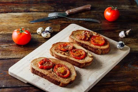 Three Toasts with Tomatoes Stock Photos