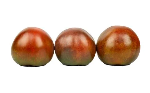 Three tomatoes kumato Stock Photos