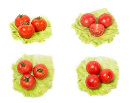 Three tomatoes lying on a sheet of green salad Stock Photos
