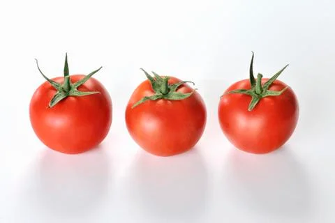 Three tomatoes Stock Photos