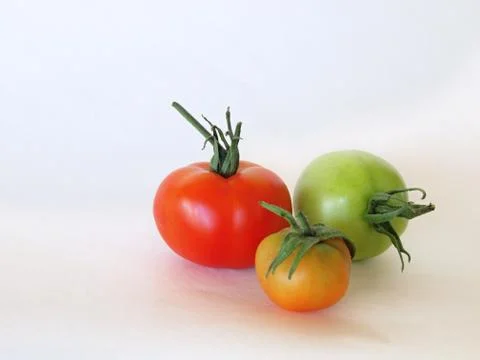 Three tomatoes Stock Photos