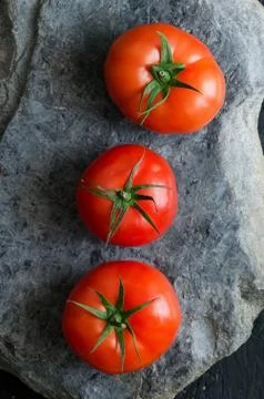 Three tomatoes Stock Photos