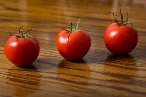 Three tomatoes Stock Photos