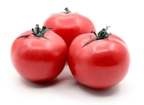 Three tomatoes on the white background Foto stock