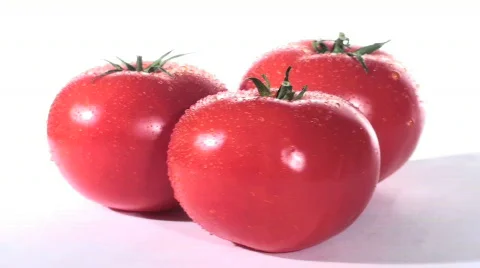 Three tomatoes wide loop  - HD  Stock Footage 371874