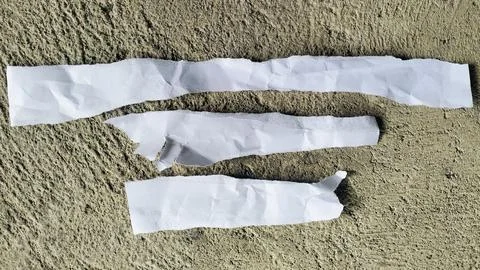 Three Torn White Paper Strips on Rough Concrete Texture Background Stock Photos