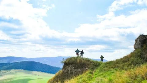 Three tourists on viewpoint Stock Photos