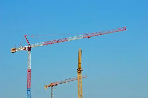 Three tower cranes Stock Photos