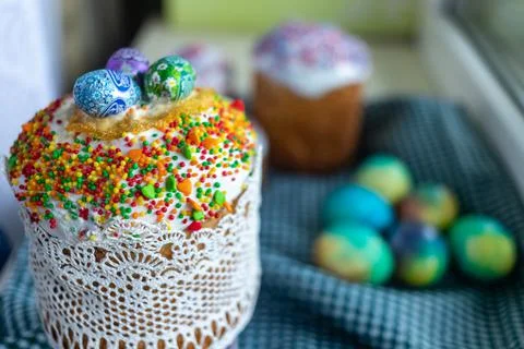 Three traditionally baked orthodox easter cakes with glace icing and bright b Stock Photos