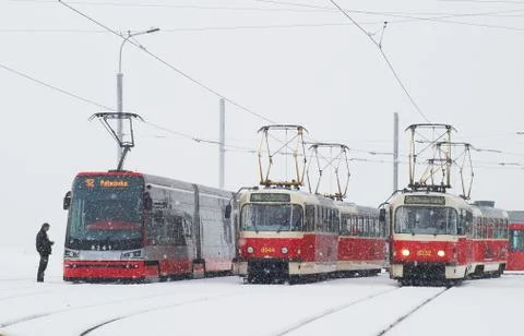 Three trams in prague in heavy snowfall Stock Photos
