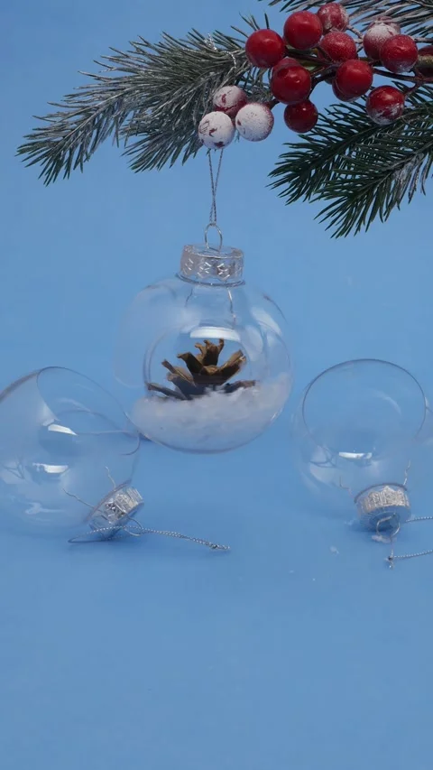 Three transparent Christmas tree decorations in the shape of a ball with a .. Stock Footage 312928451