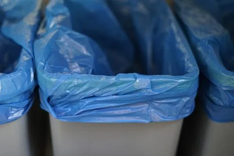 Three trash garbage bins can lid blue bags eco recycle sorted bio planet waste Stock Photos