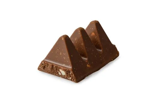 Three triangular pieces of milk chocolate with nougat and almonds isolated .. 库存照片