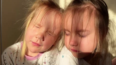 Three triplet sisters expose their faces to the sunlight Video stock 266314020
