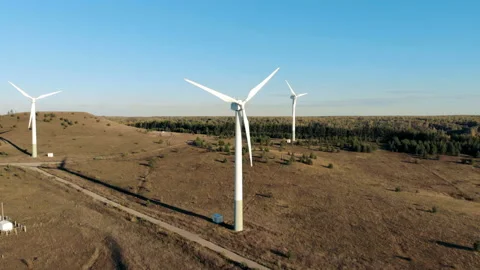 Three turbine towers are functioning in the open air. Alternative energy concept Video stock 98489493