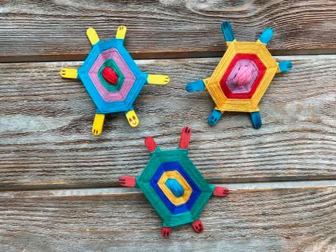 Three turtles children's creative, craft from yarn and wooden sticks. Stock Photos