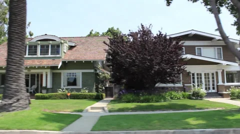 Three Two-Story House Driving Shot Video stock 32165647