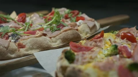 Three Types Of Appetizing Pizza. Pizza On Wooden Trays. Stock Footage 172321525